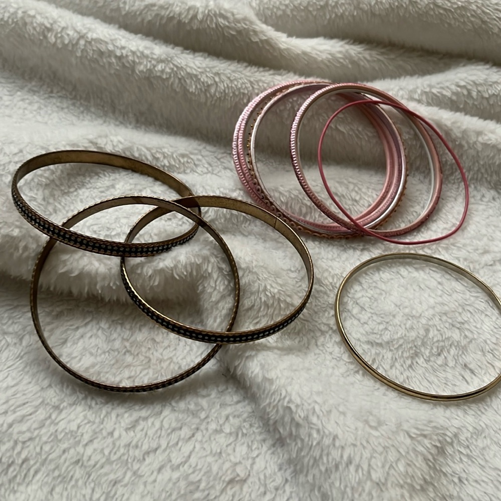 Bracelets 3 sets: pink metal, brass, goldtone.Bangles 3” are pink and brass